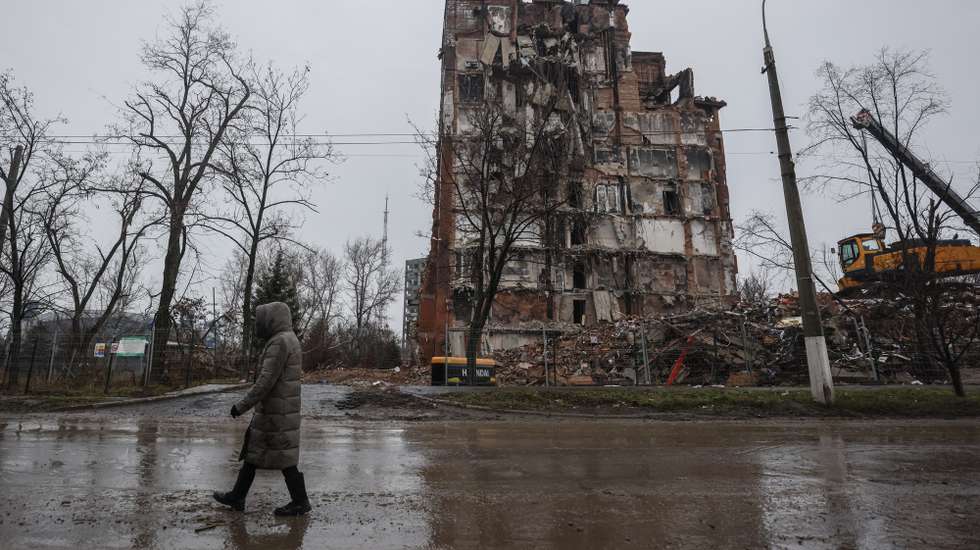 epa10362476 A local man walks in front of a destroyed building in downtown Mariupol, Ukraine, 12 December 2022. Mariupol had seen a long battle for its control between the Ukrainian forces and the Russian army and Russian backed separatist Donetsk Peopleâ€™s Republic (DPR) as well as a siege, the hostilities lasted from February to the end of May 2022 killing thousands of people and destroying most of the city in the process. According to the DPR government which took control after May 2022, more than five thousand builders are currently working in Mariupol, they expect the city to be completely rebuilt in three years' time.  EPA/SERGEI ILNITSKY