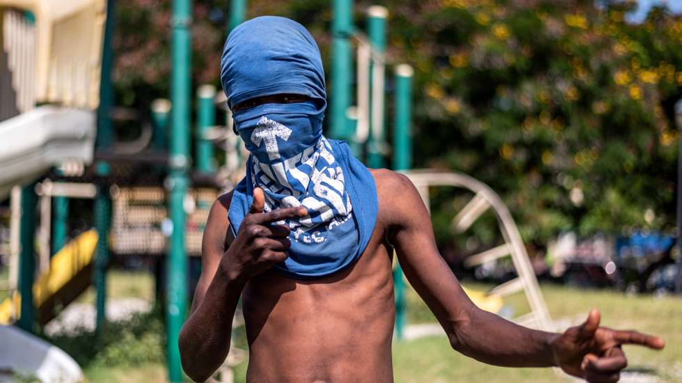 epa09986630 A young man who lives on the street tells Efe that he has no choice but to steal or join gangs in order to feed himself, in Port-au-Prince, Haiti, 27 May 2022 (issued 30 May 2022). Shelters for street children in Port-au-Prince are emptying out due to gangs, who are recruiting children to participate in the urban warfare that has terrorized Haiti's capital for a month. Since the escalation of the sociopolitical and economic crisis marked by the multiplication of armed groups, kidnappings and massacres, few children are seen on the streets of the metropolitan area of the Haitian capital.  EPA/JOHNSON SABIN  ATTENTION: This Image is part of a PHOTO SET