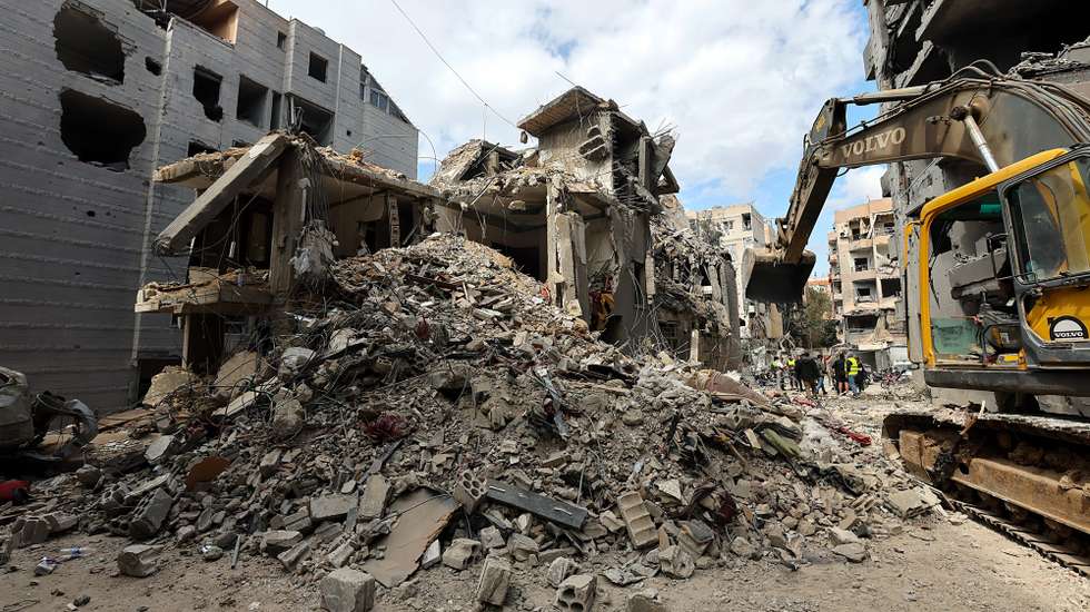 epa12880696 A bulldozer clears the rubble around buildings hit by recent Israeli air strikes, as seen during a press tour organized by the Hezbollah media office, in the Five Wings residential area, in the southern suburbs of Beirut, Lebanon, 10 April 2026. According to the Lebanese Ministry of Public Health, Israeli attacks across Lebanon have killed at least 1,888 people and injured more than 6,092 others since the start of renewed hostilities between Israel and Hezbollah on 02 March 2026.  EPA/WAEL HAMZEH