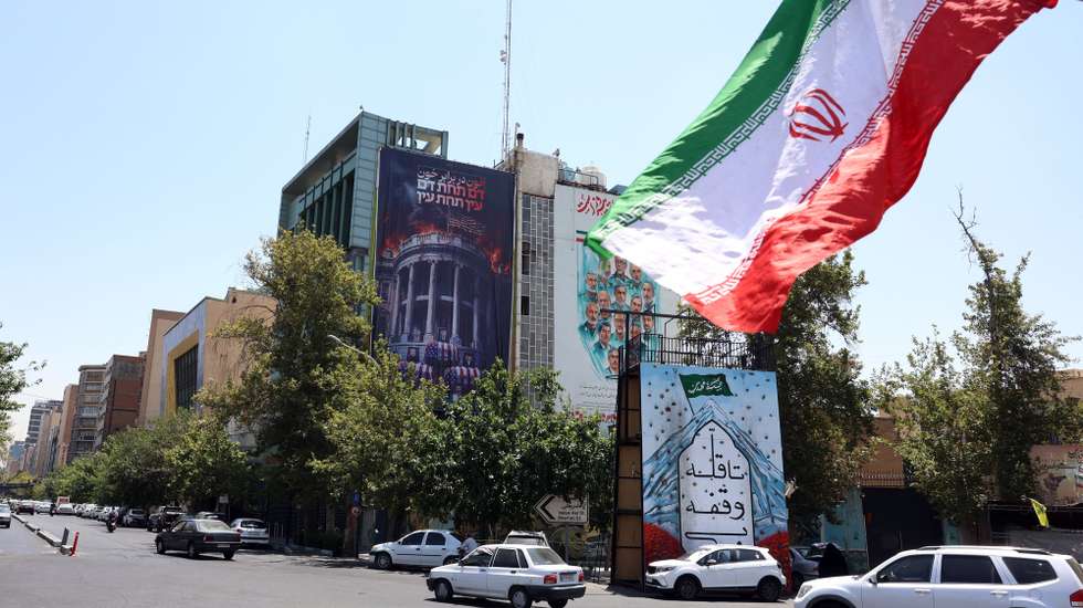 epa13114467 Iranians drive past an anti-US billboard featuring pictures of US President Donald Trump and his family on top of US flag-draped coffins, accompanied by a sentence in Persian that reads 'Blood for Blood,' that hangs at Palestine Square in Tehran, Iran, 16 July 2026. The US military has reinstated its naval blockade against Iranian ports and carried out strikes targeting Tehran's military capabilities, according to US Central Command (CENTCOM).  EPA/ABEDIN TAHERKENAREH 

RESTRICTIONS: NO Access Israel Media/Persian Language TV Stations Outside Iran/Strictly No Access BBC Persian/VOA Persian/Manoto TV/Iran International TV. (As mandated by Iran's Directorate General for Foreign Media)