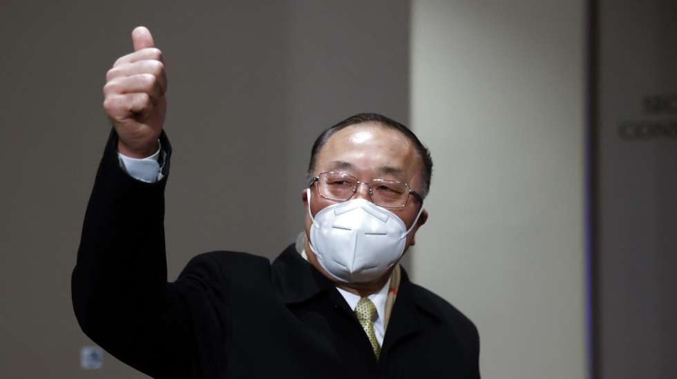 epa09728525 Chinese Ambassador to the United Nations Zhang Jun reacts towards members of the media outside the Security Council before a closed door meeting on the situation with North Korea at United Nations headquarters in New York, New York, USA, 04 February 2022.  EPA/JASON SZENES