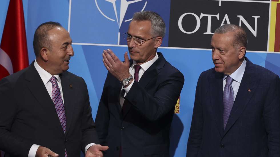 epa10039539 NATO Secretary General Jens Stoltenberg (c), together with Turkey's Foreign Minister, Mevlut Cavusoglu (l), and President Recep Tayyip Erdogan (r), after signing an agreement to unlock the Turkish veto on access from Finland and Sweden to NATO, in Madrid, Spain, 28 June 2022.  EPA/Kiko Huesca