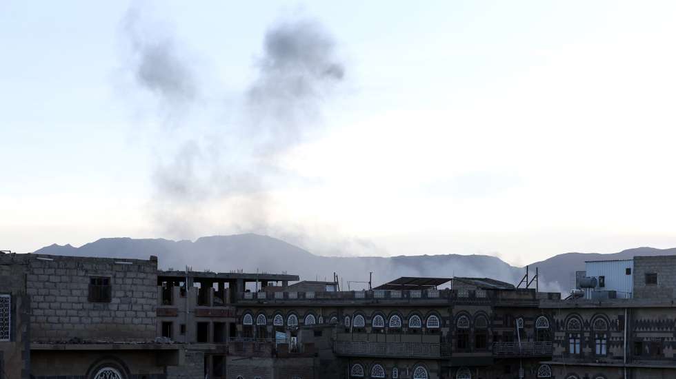 epa11642089 Smoke rises from a site following US-British airstrikes, in Sana'a, Yemen, 04 October 2024. US-British airstrikes on 04 October hit Houthi sites in three Yemeni cities, including Sana'a, Hodeidah and Dhamar, amid the escalation of the Houthi shipping attacks in the seas around Yemen and on targets in Israel, according to the Houthis-run Al-Masirah TV.  EPA/YAHYA ARHAB
