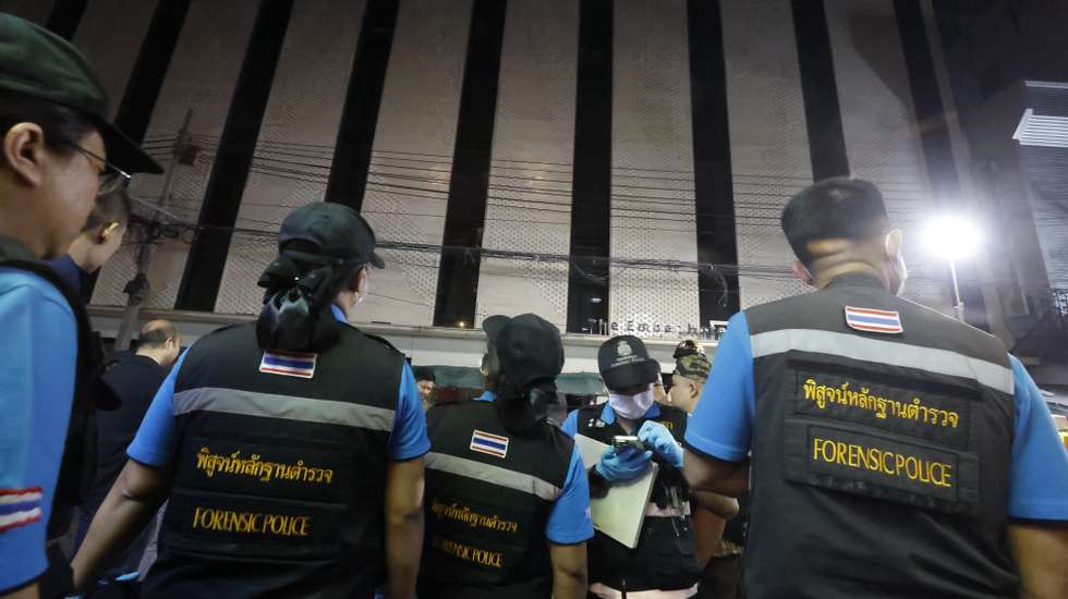epa11797953 Forensic police officers inspect the scene of a blaze at The Ember Hotel in Bangkok, Thailand, 29 December 2024. According to police at the scene, a number of casualties were reported when a fire broke out at the hotel near the tourist spot of Khao San Road.
