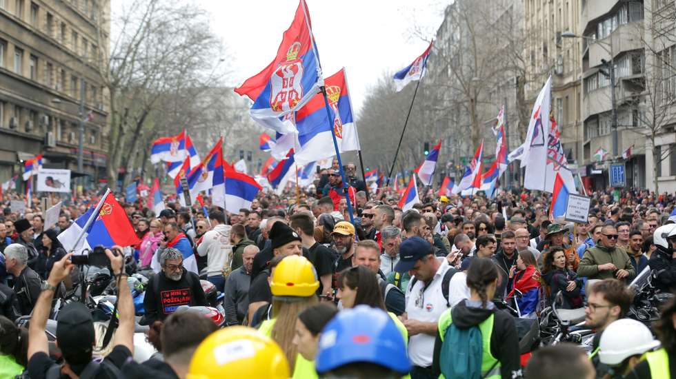epa11965648 Protesters wave Serbian flags during the student-led rally in Belgrade, Serbia, 15 March 2025.  University students staged a protest, demanding accountability after fifteen people lost their lives in the collapse of the Novi Sad Railway Station canopy in November 2024. The station building, which had been renovated and reopened in July 2024, was undergoing further renovations shortly before the collapse.  EPA/ANDREJ CUKIC