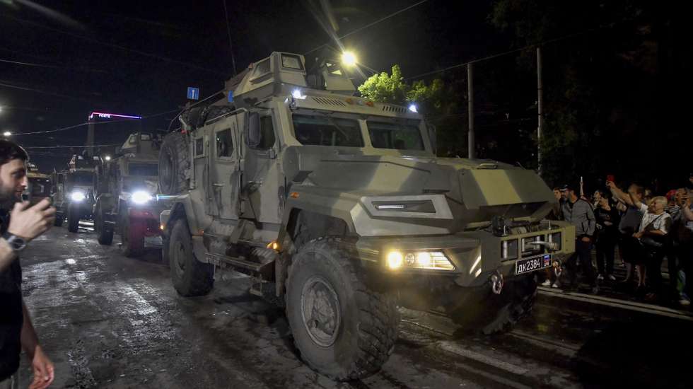 epa10710235 Private military company (PMC) Wagner Group servicemen prepare to leave downtown Rostov-on-Don, southern Russia, 24 June 2023. Security and armoured vehicles were deployed after the Chief of the private military company (PMC) Wagner Group said in a video that his troops had occupied the building of the headquarters of the Southern Military District, demanding a meeting with Russia's defense chiefs. The President of Belarus held talks with the head of the Wagner group, as a result of which he accepted a proposal to stop the movement of the group's fighters across Russia, the press service of the President of Belarus reported. The Chief of Wagner Group has said that columns of his group will return to field camps.  EPA/ARKADY BUDNITSKY