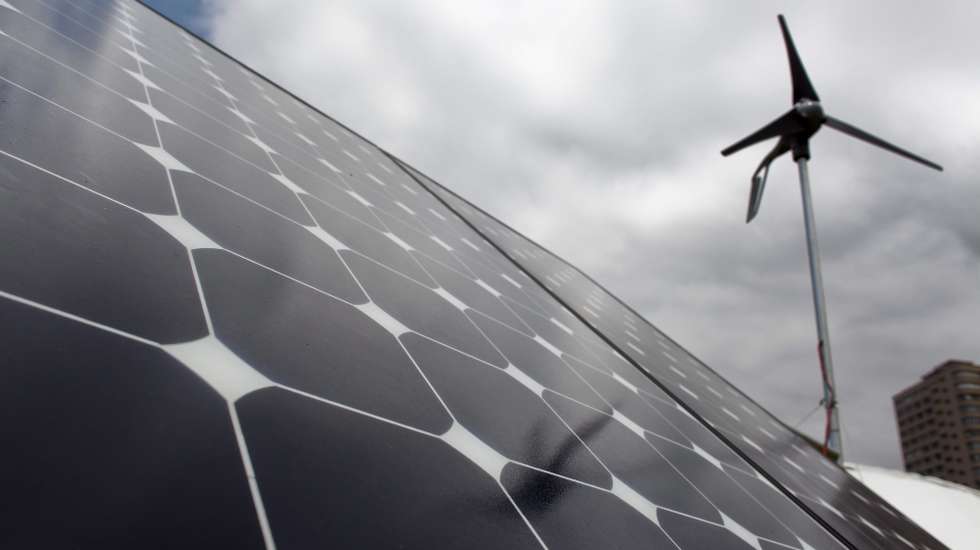 epa03018604 A solar panel and wind generator at the Greenpeace renewable energy center on Durban's beachfront during the COP 17 / CMP 7 United Nations (UN) Climate Change Conference 2011 in Durban, South Africa 29 November 2011. COP 17 is the 17th session of the Congress of the Parties (COP) comprising 194 countries meeting to discuss the United Nations Framework Convention on Climate Change (UNFCCC) between 28 November and 09 December 2011.  EPA/NIC BOTHMA