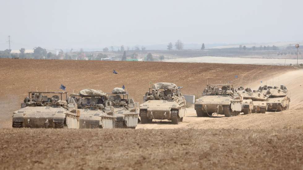 epa11645084 A convoy of Israeli armoured vehicles makes its way to the northern Gaza Strip, as seen from the border with Gaza in southern Israel, 06 October 2024. Israel's military stated on 06 October, they have been conducting since last night an 'operation to systematically dismantle terrorist infrastructure' in the area of Jabalia, in the northern Gaza Strip. The Israel Air Force conducted strikes on dozens of military targets in order to assist IDF ground troops operating in the area, the statement added.  EPA/ABIR SULTAN