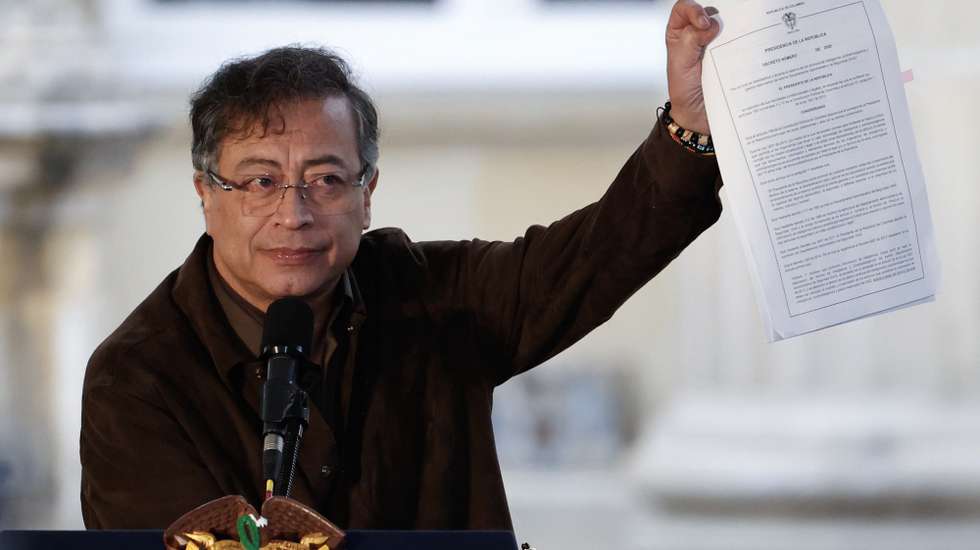 epa12461356 Colombian President Gustavo Petro waves a document declassifying the archives of the now-defunct Administrative Department of Security (DAS) during a public ceremony recognizing the state's international responsibility before the Jose Alvear Restrepo Lawyers' Collective (Cajar) in Bogota, Colombia, 17 October 2025. The Colombian state publicly apologized to the collective for more than three decades of persecution, harassment, and illegal intelligence gathering, in compliance with the ruling of the Inter-American Court of Human Rights (IACHR), which in 2024 declared its international responsibility.  EPA/MAURICIO DUENAS CASTANEDA