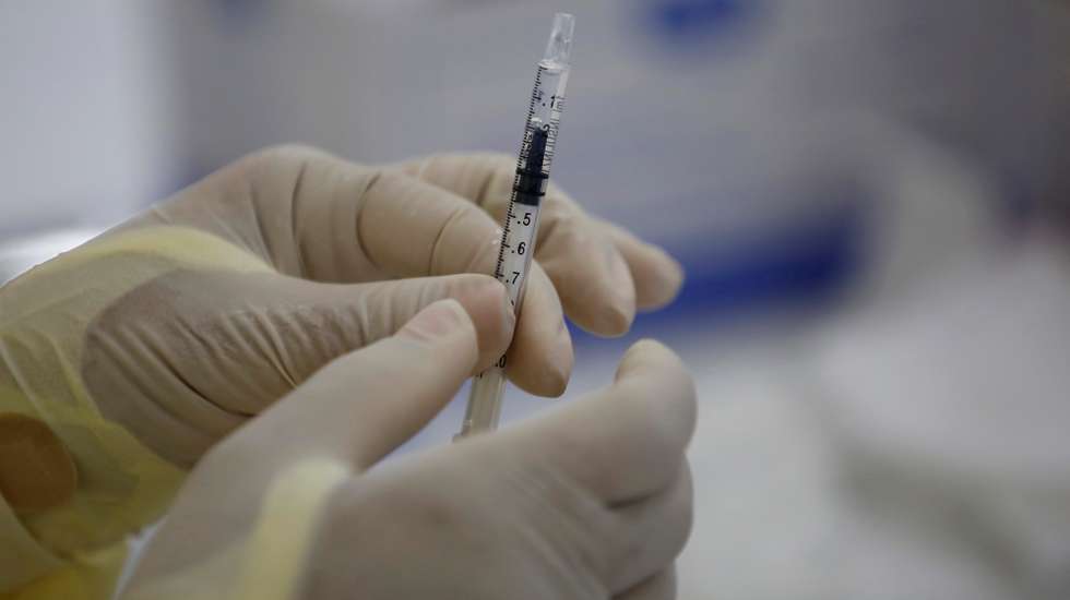 epa09150870 Medical personnel prepare a Pfizer vaccine against covid-19 during a day of applying second doses to the population, at the Manuel Jose Hurtado school, in the Chorrillo neighborhood in Panama City, Panama, 21 April 2021. After the strong pandemic rebound at the end of 2020, Panama now exhibits 'control' of the covid-19, the director of the Metropolitan Health region, Israel Cedeno, told EFE on Wednesday, warning of an expected increase in cases in the short term due to the recent economic reopening. Panama accumulates at least 361,319 confirmed infections and 6,192 deaths from covid in just over a year of pandemic, and since last January 20 it has applied 569,277 doses of vaccine against the disease, all from the pharmaceutical company Pfizer.  EPA/Bienvenido Velasco