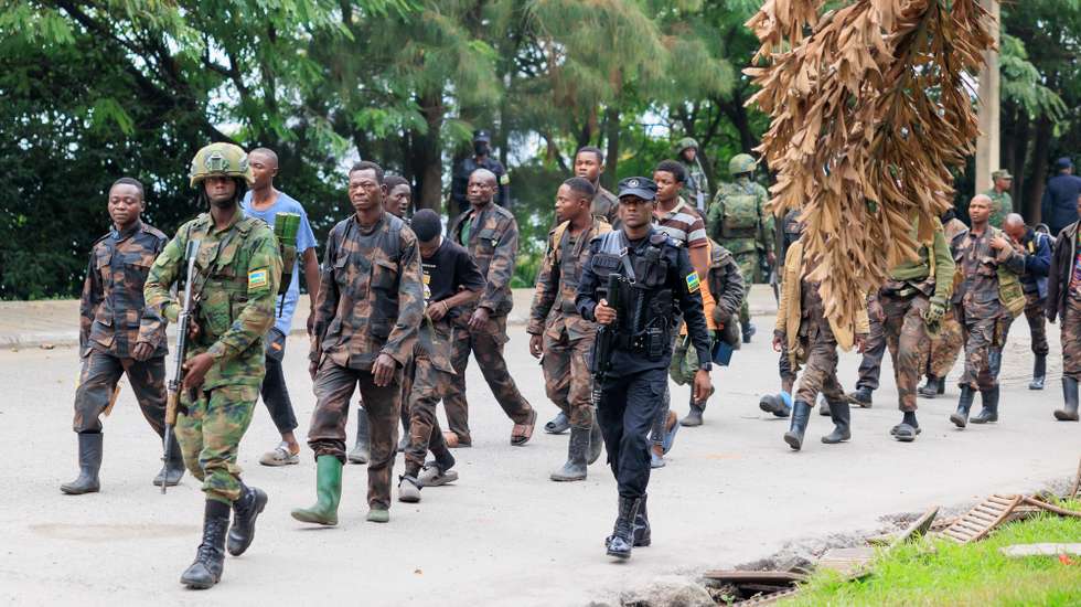 epa11856263 Surrendering members of the Armed Forces of the Democratic Republic of the Congo (FARDC) are escorted by Rwandan soldiers after crossing the border from Goma, in the Democratic Republic of the Congo, to Gisenyi, Rwanda, 27 January 2025. Refugees have been crossing into Rwanda in search of safety as soldiers of the Armed Forces of the Democratic Republic of the Congo (FARDC) and M23 rebels continue to fight in the city of Goma. According to the UN Refugee Agency (UNHCR), violence in the eastern Democratic Republic of the Congo (DRC) has displaced 237,000 people in 2025.  EPA/MOISE NIYONZIMA