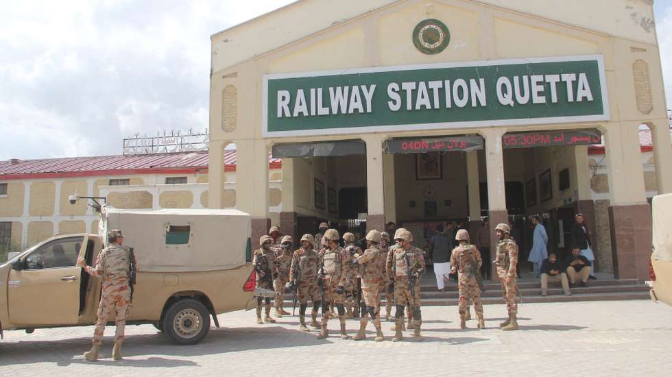 epa11958021 Pakistani security officials secure the Quetta Railway Station after all train services were suspended following an attack by militants on the Peshawar-bound Jaffar Express train, in Quetta, Balochistan province, Pakistan, 12 March 2025.  EPA/SAMI KHAN