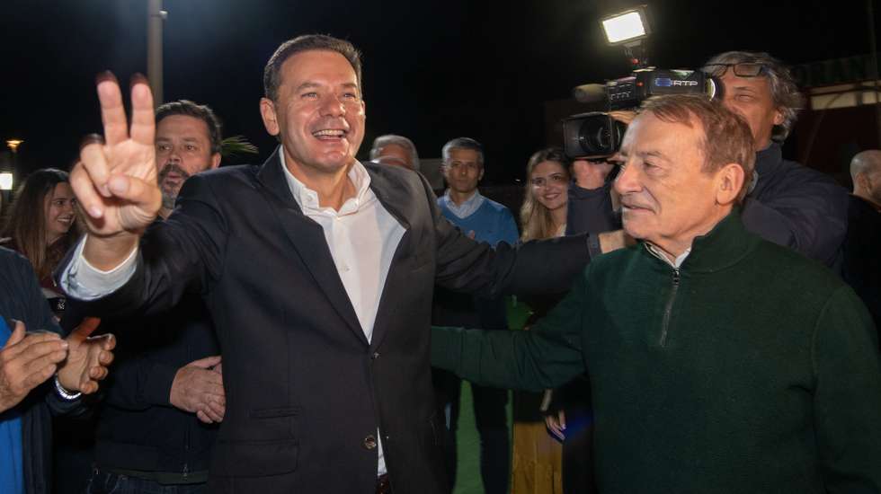 Portuguese Prime Minister and President of the Social Democratic Party (PSD), Luís Montenegro (L), and celebrates with the candidate of the PSD Vila Nova de Gaia City Council, Luís Filipe Menezes (R), on election night for the local elections at party headquarters in Porto, Portugal, 13 October 2025. More than 9.3 million electors can vote in the local elections in Portugal on 12 October 2025. RUI MANUEL FARINHA/LUSA