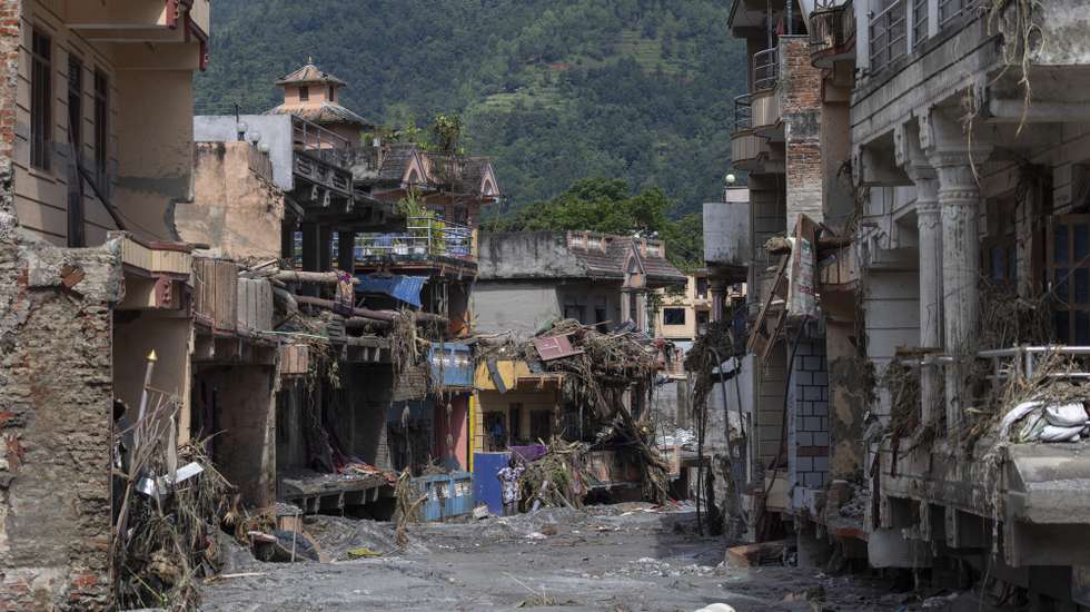 epa13194328 A flood survivor returns to home following a flash flood in Devighat Village, Nuwakot district, Nepal, 27 August 2026. More than 160 people have died and hundreds remain missing across northern Nepal after a suspected avalanche triggered massive flash floods and mudslides along the Bhotekoshi and Trishuli river near the Nepal-Tibet border, causing widespread destruction to settlements and infrastructure, according to local authorities.  EPA/NARENDRA SHRESTHA