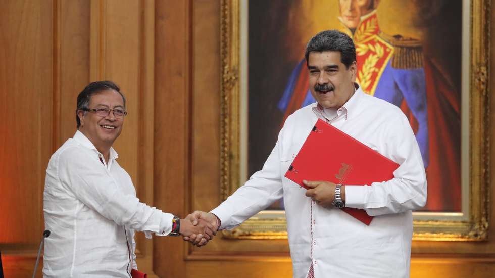 epa10280331 President of Venezuela Nicolas Maduro (R) shakes hands with his Colombian counterpart President Gustavo Petro after a press conference at the Miraflores Palace, in Caracas, Venezuela, 01 November 2022. The meeting of both leaders is held in order to discuss the bilateral relationship, the reopening of the border, and the re-entry of the Caribbean country to the Inter-American Human Rights System.  EPA/Miguel Gutierrez