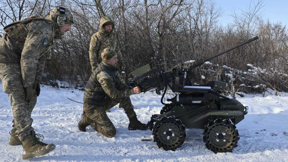 epa12683327 A handout photo made available by the press service of the 65th Separate Mechanized Brigade of the Ukrainian Armed Forces shows Ukrainian servicemen testing a combat ground drone armed with a 12.7mm Browning M2 machine gun, during their training in the Zaporizhzhia region, Ukraine, 26 January 2026, amid the ongoing Russian invasion. Russian troops entered Ukrainian territory on 24 February 2022, starting a conflict that has provoked destruction and a humanitarian crisis.  EPA/Press service of the 65th Mechanized Brigade HANDOUT HANDOUT  HANDOUT EDITORIAL USE ONLY/NO SALES