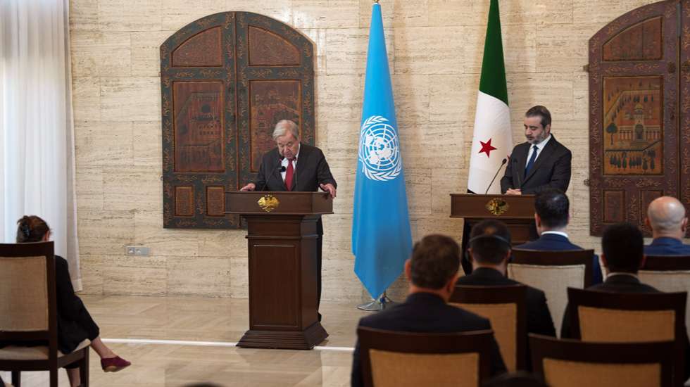 epa13132250 UN Secretary-General Antonio Guterres (L) speaks during a joint press conference with Syrian Foreign Minister Asaad Shaibani (R) in Damascus, Syria, 25 July 2026. The visit is the first by a United Nations secretary-general to Damascus since 2009.  EPA/MOHAMMED AL-RIFAI