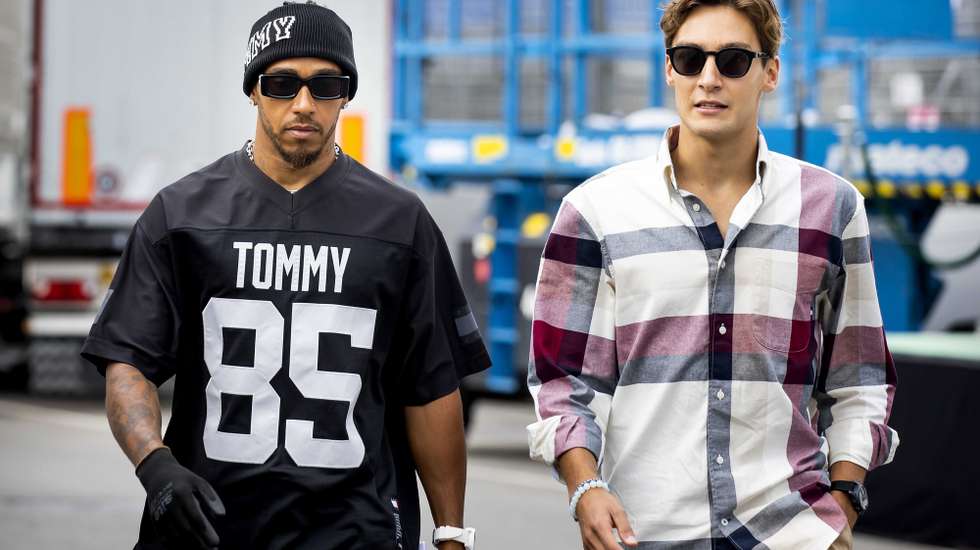 epa10817139 Mercedes-AMG drivers George Russell (R) and Lewis Hamilton of Britain arrive at Circuit Zandvoort racetrack in Zandvoort, Netherlands, 24 August 2023. The Formula 1 Dutch Grand Prix is held on 27 August 2023.  EPA/Koen van Weel