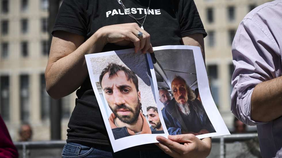 epa12927806 Photos of activists wounded by Israeli soldiers are displayed during the demonstration in front of the Farnesina to demand the release of two Global Sumud Flotilla (GSF) activists, Saif Abukeshek and Thiago Avila, held by Israeli authorities, in Rome, Italy, 02 May 2026.  EPA/RICCARDO ANTIMIANI