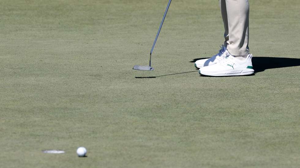 epa12878220 Danny Willett of England putts as the ball circles the drain and does not fall into the drain on hole 2 during Round 1 of the 2026 Masters tournament in August, Georgia, USA, 09 April 2026.  EPA/ERIK S. LESSER