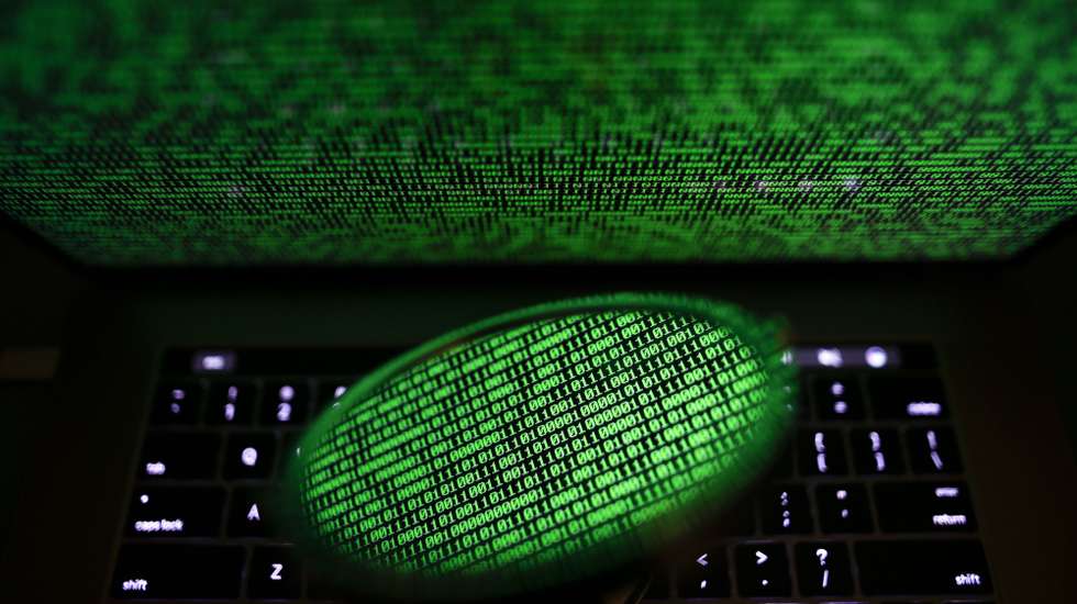 epa06053461 A mirror reflects a computer screen displaying binary code in Taipei, Taiwan, 28 June 2017. Kaspersky Lab reported that the malware, despite resembling 'Petya' malware that affected computers last year, is believed to be a new type of ransomware, which the cybersecurity company called 'ExPetr'. The ransomware has reportedly affected mostly Ukraine and Russia and several cases were also found in Poland, Italy, Britain, Germany, France, the US and several other countries, with around 2,000 cases reported so far. The ransomware has reportedly affected US pharmaceutical giant Merck, Russia's oil producer Rosneft, Ukrainian central bank, Spanish food company Mondelez, Australia's Cadbury chocolate factory and French shipping company TNT, among other global companies.  EPA/RITCHIE B. TONGO