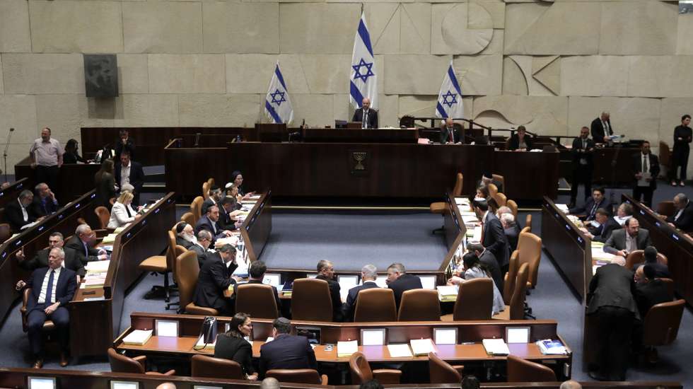 epa10766137 Israel's Knesset Speaker Amir Ohana (C) presides over a session to vote on law on justice system reform, Israel, 24 July 2023. Mass protests continue across the country as the Israeli parliament, or Knesset, is set to hold a final vote on the bill that would limit the Supreme Court's powers.  EPA/ABIR SULTAN