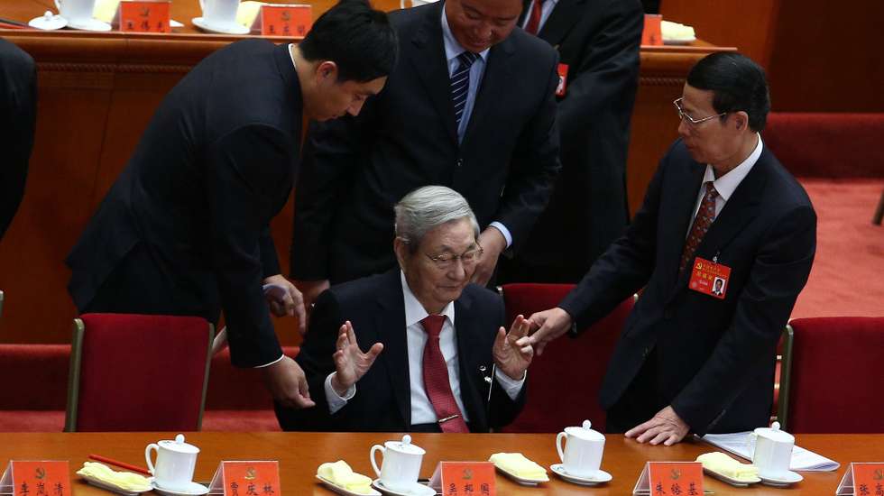 epa06272552 Former Chinese Premier Zhu Rongji (C) gestures while attendants try to help him to leave after the opening ceremony of the 19th National Congress of the Communist Party of China (CPC) at the Great Hall of the People (GHOP) in Beijing, China, 18 October 2017. China holds the 19th Congress of the Communist Party of China, the country's most important political event where the party's leadership is chosen and plans are made for the next five years. Xi Jinping is expected to remain as the General Secretary of the Communist Party of China for another five-year term.  EPA/WU HONG