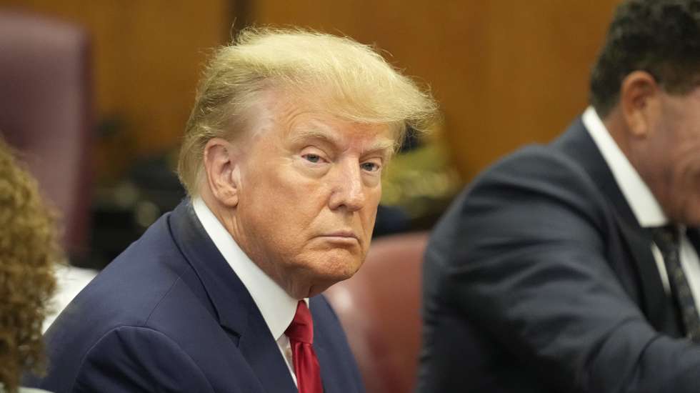 epa10558784 Former US President Donald J. Trump sits in the courtroom for his arraignment in New York Criminal Court in New York, New York, USA, 04 April 2023. A Manhattan grand jury voted to indict former President Donald J. Trump last week.  EPA/SETH WENIG POOL