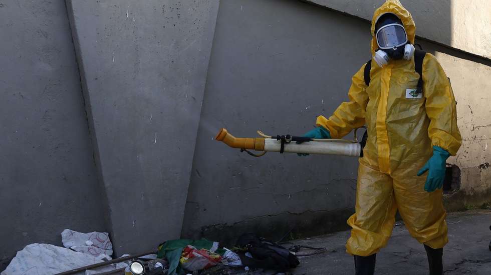 epa05127226 A local worker disinfects the famous Sambadrome in Rio de Janeiro, Brazil, 26 January 2016, ahead of the beginning of Rio's Carnival parades, on next 05 February, to fight against the mosquito Aedes aegypti, which spreads the Zika, Dengue and Chikunguna viruses. The carnival stadium Sambadrome will host the archery events during the Summer Olympic Games Rio 2016.  EPA/MARECELO SAYAO