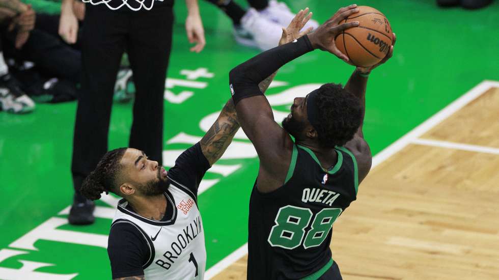 epa11972957 Brooklyn Nets guard D'Angelo Russell (L) can not block the shot of Boston Celtics center Neemias Queta (R) during the first half of the NBA game between the Boston Celtics and the Brooklyn Nets in Boston, Massachusetts, USA, 18 March 2025.  EPA/CJ GUNTHER SHUTTERSTOCK OUT