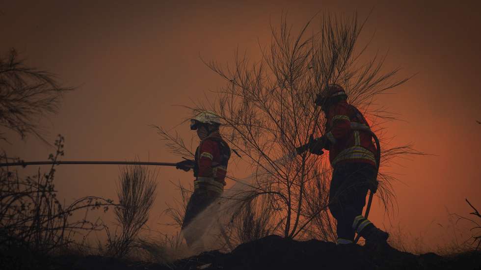 A firefighter fights the flames during a wildfire in Valpacos, Portugal, 30th July 2026. The fire, which broke out on Tuesday in the municipality of Valpaços and spread to those of Mirandela and Vinhais, has three active fronts this evening, and additional resources and personnel have been deployed, according to the Civil Protection Agency. PEDRO SARMENTO COSTA/LUSA