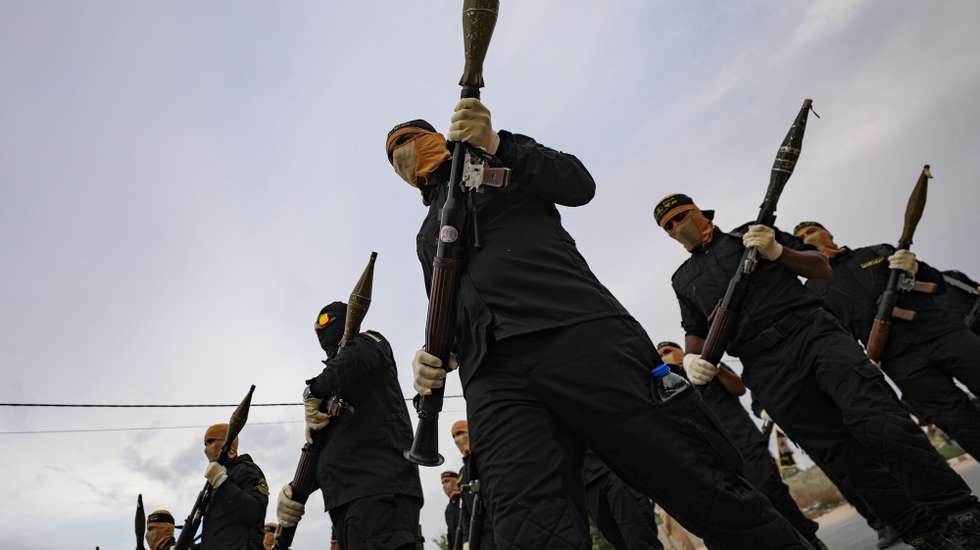 epa10900401 Fighters of the Al-Quds Brigades, the armed wing of the Palestinian Islamic Jihad (PIJ) movement, hold RPGs (rocket propelled grenade launchers) as they mark the 36th anniversary of the movement's foundation with a parade in the southern of Gaza Strip, 04 October 2023.  EPA/MOHAMMED SABER