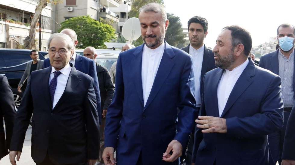 epa11265949 Iranian Foreign Minister Hossein Amir-Abdollahian (C) with Syrian Foreign Minister Faisal Mekdad (L) visit destroyed Iranian consulate site in Damascus, Syria, 08 April 2024. Iran's foreign minister is in Damascus to inaugurate new Iranian consular services, a week after an April 1 airstrike on the Iranian consulate building in the Syrian capital Damascus that Iran blamed on Israel.  EPA/YOUSSEF BADAWI
