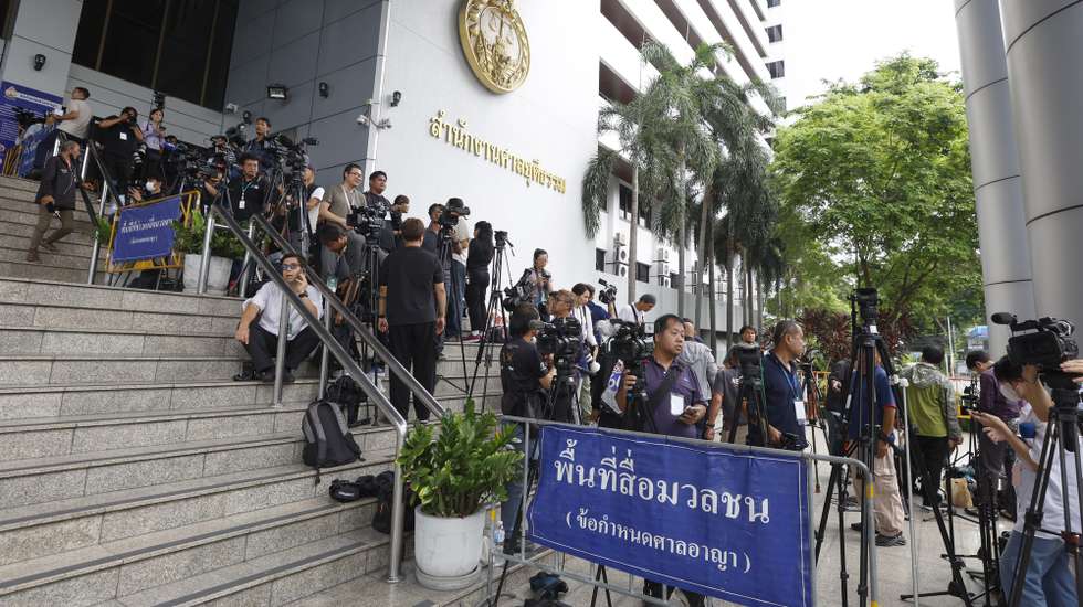 epa12207608 Media wait to report on the lese-majeste trial of former Thai Prime Minister Thaksin Shinawatra in front of the Criminal Court in Bangkok, Thailand, 01 July 2025. Thaksin faces charges under the lese-majeste law and the Computer Crime Act for allegedly defaming the monarchy in comments made during an interview with a South Korean newspaper in May 2015. Thaksin denies all charges and has posted bail.  EPA/NARONG SANGNAK