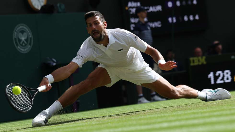epa12222644 Novak Djokovic of Serbia in action during the Men's Singles Fourth Round match against Alex de Minaur of Australia at the Wimbledon Championships, Wimbledon, Britain, 07 July 2025.  EPA/NEIL HALL  EDITORIAL USE ONLY
