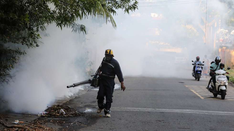 epa12212876 A health worker fumigates with insecticide to curb mosquito breeding in an attempt to control dengue and chikungunya fever in Colombo, Sri Lanka, 03 July 2025. According to the National Dengue Control Unit, over 28,000 dengue cases and 16 related deaths have been reported in Sri Lanka over the past six months, with 45 percent of the cases recorded in the Western Province. In response, the Ministry of Health launched the National Mosquito Control Week from 30 June to 06 July to combat the spread of dengue and chikungunya.  EPA/CHAMILA KARUNARATHNE