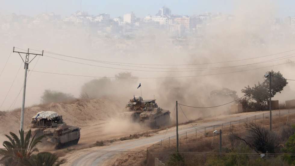 epaselect epa11645086 A convoy of Israeli armoured vehicles makes its way to the northern Gaza Strip, as seen from the border with Gaza in southern Israel, 06 October 2024. Israel's military stated on 06 October, they have been conducting since last night an 'operation to systematically dismantle terrorist infrastructure' in the area of Jabalia, in the northern Gaza Strip. The Israel Air Force conducted strikes on dozens of military targets in order to assist IDF ground troops operating in the area, the statement added.  EPA/ABIR SULTAN