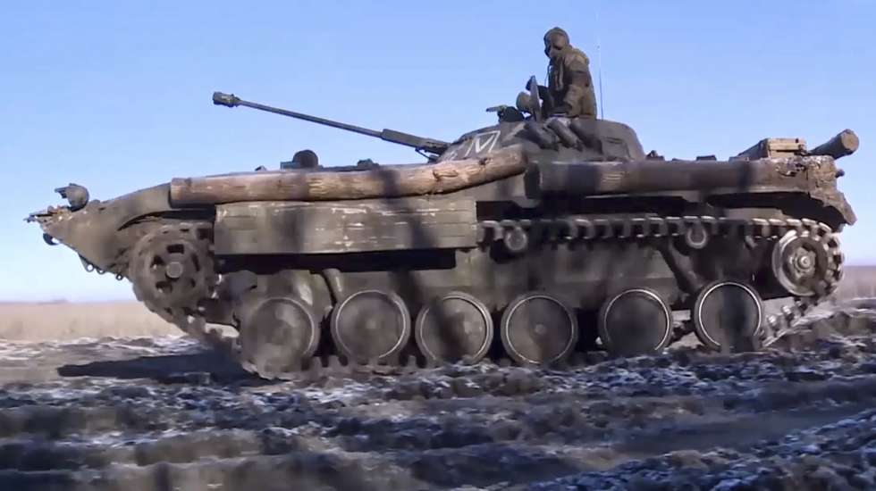 epa10403450 A still image taken from a handout video provided by the Russian Defence Ministry Press-Service on 13 January 2023 shows servicemen of Russia's Marine Corps of the Pacific Fleet moving on an infantry fighting vehicle at an undisclosed location in Ukraine. The Russian Defence Ministry said that 'in the evening of 12 January, the city of Soledar, that is of great importance for continuing successful offensive operations in Donetsk direction, was liberated' as what Moscow calls a 'special military operation' continues in Ukraine. Russian troops entered Ukrainian territory on 24 February 2022, starting a conflict that has provoked destruction and a humanitarian crisis.  EPA/RUSSIAN DEFENCE MINISTRY PRESS SERVICE HANDOUT -- MANDATORY CREDIT -- BEST QUALITY AVAILABLE -- HANDOUT EDITORIAL USE ONLY/NO SALES