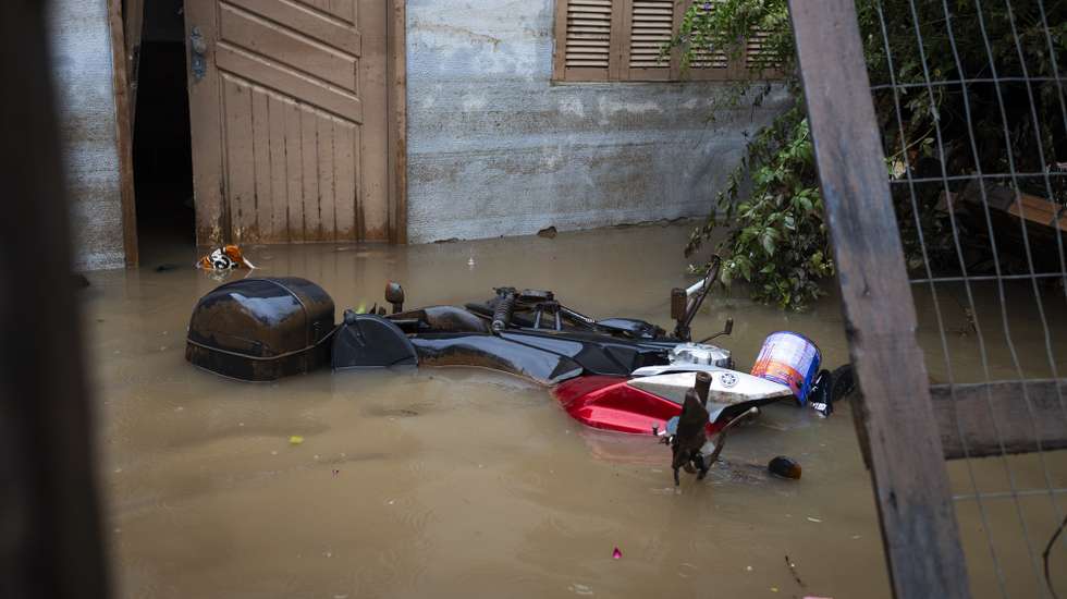 epa11332375 A motorcycle is submerged in water due to a flood, in Eldorado do Sul, metropolitan region of Porto Alegre, Brazil, 10 May 2024. The death toll from the floods that have hit southern Brazil for a week reached 127, and the number of people affected by the flood waters reached almost two million, according to the latest Civil Defense bulletin.  EPA/Isaac Fontana