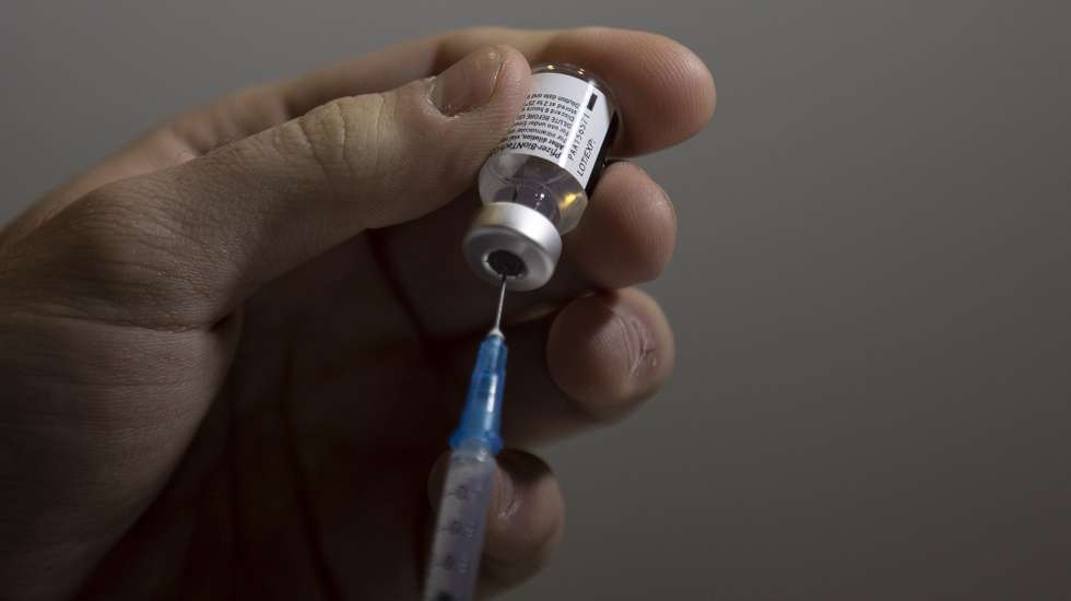 epa09031402 A close-up view of a vaccine against COVID-19 in the  Medical Center in Jerusalem, Israel,  23 February 2021. Israel has so far vaccinated over four and a half  million of its around nine million citizens with the first dose of COVID-19 vaccine and three million have been given the second dose of the vaccine.  EPA/ATEF SAFADI