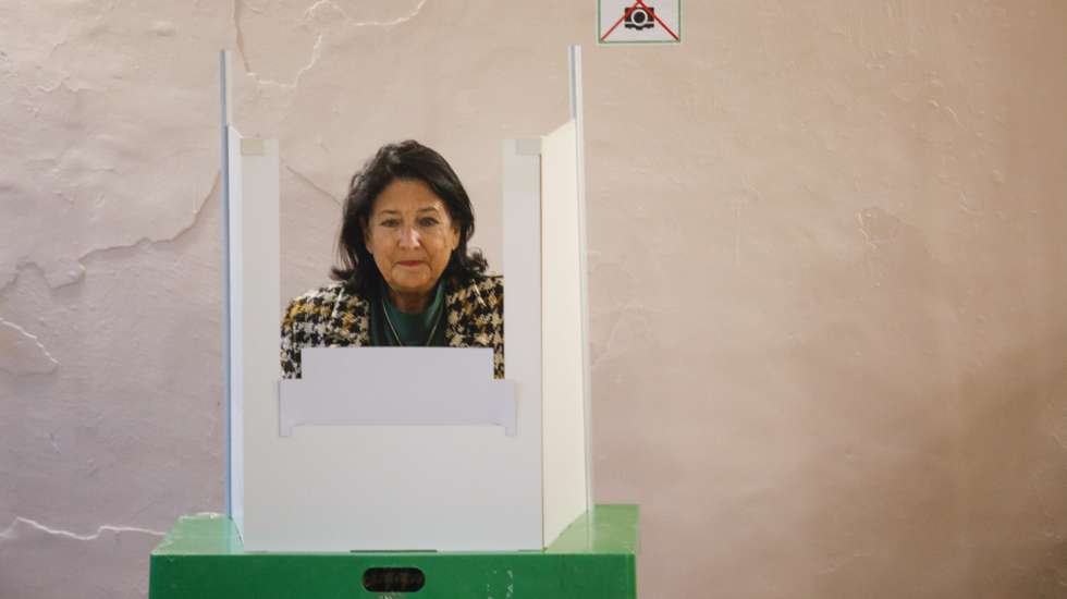 epa11684084 Georgian President Salome Zourabichvili casts her ballot during parliamentary elections, at a polling station in Tbilisi, Georgia, 26 October 2024. A total of 18 parties are participating in the parliamentary elections in Georgia. Three thousand, one hundred and eleven polling stations opened for the parliamentary elections, including 67 abroad. Voting abroad will be possible in 53 cities in 42 countries.  EPA/DAVID MDZINARISHVILI
