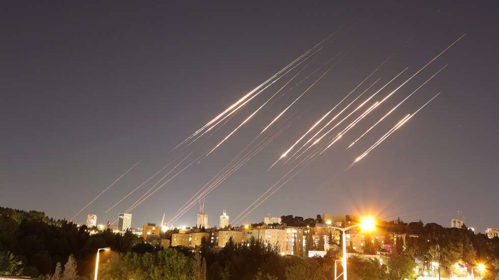 epa12175801 A slow exposure picture shows ballistic missiles above Jerusalem, 14 June 2025. Israel's military has identified missiles being launched from Iran towards the territory of Israel in retaliation following overnight airstrikes on Iranian targets.  EPA/ABIR SULTAN