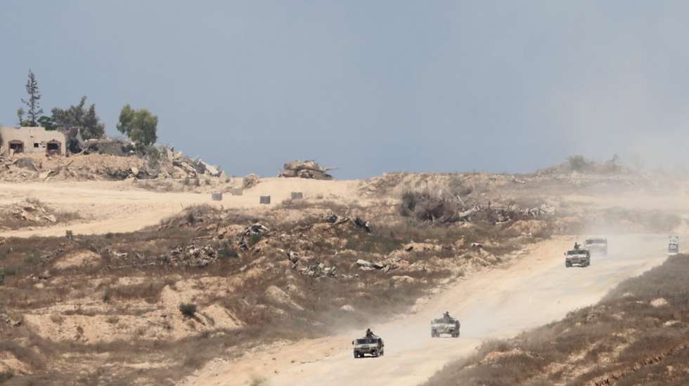 epa11472146 Israeli army vehicles patrol inside Gaza as seen from the Israeli side of the border with the Gaza Strip, southern Israel, 11 July 2024. More than 37,000 Palestinians and over 1,400 Israelis have been killed, according to the Palestinian Health Ministry and the Israel Defense Forces (IDF), since Hamas militants launched an attack against Israel from the Gaza Strip on 07 October 2023, and the Israeli operations in Gaza and the West Bank which followed it.  EPA/ABIR SULTAN