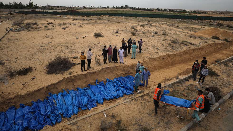 epa11072410 (FILE) - epa10989529 The bodies of 111 Palestinians killed in Israeli strikes on Gaza lie in a mass grave during their burial at the Khan Younis cemetery in the southern Gaza Strip, 22 November 2023. (Issued 12 January 2024). Upcoming 14 January 2024 will mark the one-hundredth day since Hamas' attack on Israel. More than 23,600 Palestinians and at least 1,300 Israelis have been killed, according to the Palestinian Health Ministry and the Israel Defense Forces (IDF), since Hamas militants launched an attack against Israel from the Gaza Strip on 07 October, and the Israeli operations in Gaza and the West Bank which followed it.  EPA/MOHAMMED SABER
