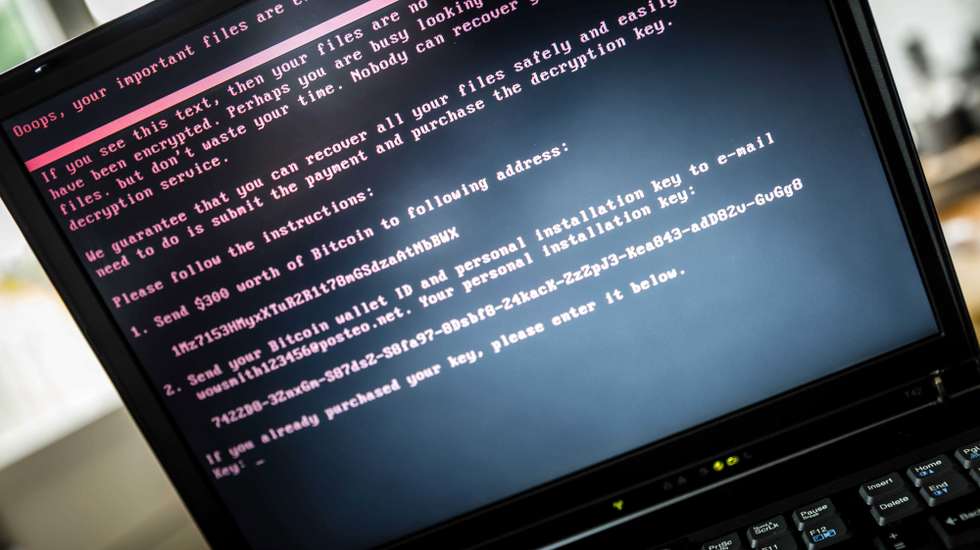 epaselect epa06053537 A laptop screen displays a message after it was infected with ransomware during a worldwide cyberattack, in Geldrop, Netherlands, 27 June 2017 (issued 28 June 2017). Kaspersky Lab reported that the malware, despite resembling 'Petya' malware that affected computers last year, is believed to be a new type of ransomware, which the cybersecurity company called 'ExPetr'. The ransomware has reportedly affected mostly Ukraine and Russia and several cases were also found in Poland, Italy, Britain, Germany, France, the US and several other countries, with around 2,000 cases reported so far. The ransomware has reportedly affected US pharmaceutical giant Merck, Russia's oil producer Rosneft, Ukrainian central bank, Spanish food company Mondelez, who owns Cadbury chocolate factory and French shipping company TNT, among other global companies.  EPA/ROB ENGELAAR