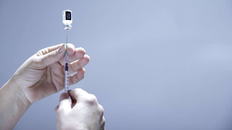 epa09037758 A medical worker prepares a dose of Pfizer Covid-19 vaccine at Belgrade Fair vaccination center in Belgrade, Serbia, 25 February 2021. The commitment to buy millions of vaccines from China and Russia, despite their aspiration to enter the European Union (EU) in the coming years, and good planning has allowed Serbia to lead the rate of vaccination in continental Europe. Until today the Balkan country has already injected some 1.3 million doses among its 7 million inhabitants.  EPA/ANDREJ CUKIC