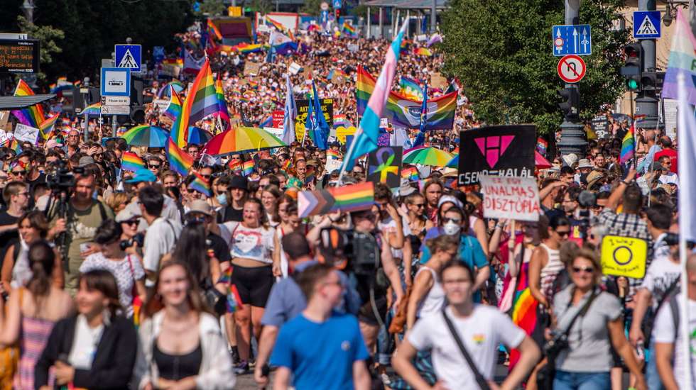 epa09362703 Anti protesters stand behind a barricade  during the gay pride parade in downtown Budapest, Hungary, 24 July 2021.  EPA/ZOLTAN BALOGH HUNGARY OUT