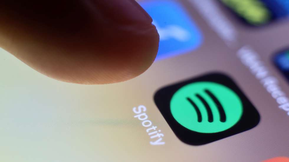 epa09044616 (FILE) - The logo of music streaming company Spotify is pictured on a smartphone in Taipei, Taiwan, 30 July 2020 (reissued 01 March 2021). Spotify confirmed on 01 March 2021 it had removed hundreds of K-Pop releases from its worldwide streaming services over licensing disputes with South Korean distributor Kakao M.  EPA/RITCHIE B. TONGO *** Local Caption *** 56665503
