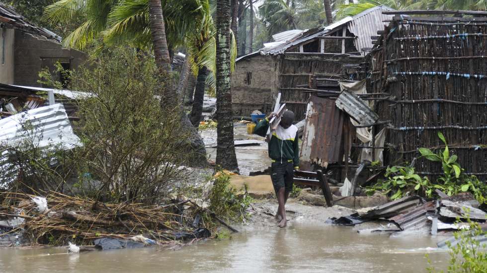 epaselect epa10517496 A man collects some wood on a flooded street near Quelimane, as the storm Freddy hits Mozambique, 12 March 2023. The provincial capital of Quelimane will be the largest urban area closest to the cyclone's point of arrival on the mainland, and its radius (of about 300 kilometres) is expected to extend from Marromeu to Pebane, then moving inland towards Cherimane and southern Malawi. This is one of the longest lasting storms ever, after it formed at the beginning of February in the Asian seas, crossing the entire Indian Ocean to the east African coast.  EPA/ANDRE CATUEIRA