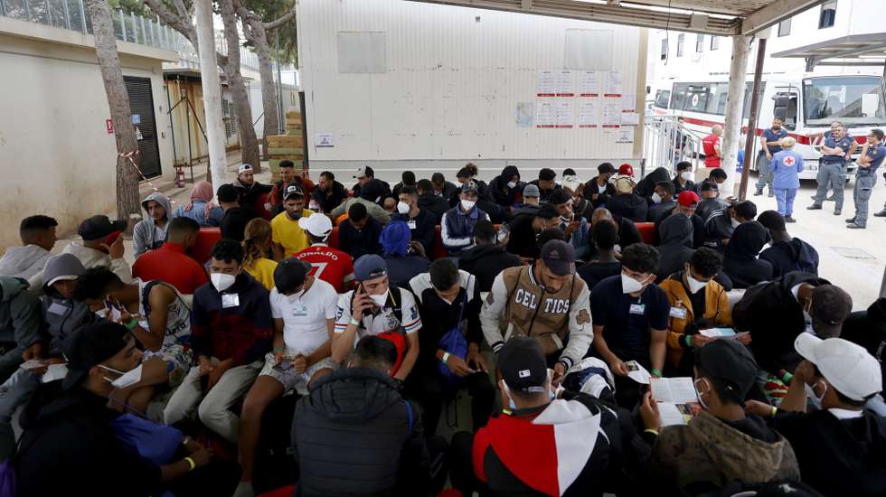 epa10692630 Migrants inside the immigrant reception facility, or 'hotspot' on the Sicilian island of Lampedusa (Agrigento), southern Italy, 14 June 2023 (issued 15 June 2023). The Lampedusa hotspot, with a capacity to host about 650 people, is managed by the Italian Red Cross (CRI). The center is intended to provide preliminary reception, identification and triage for migrants and refugees arriving on the tiny southern Italian island. Located in the Mediterranean between Malta and Tunisia, Lampedusa is a transit point for migrants from Africa, the Middle East and Asia seeking a better life in Europe. Upcoming 20 June 2023 marks World Refugee Day under the theme 'hope away from home'. The annual international day celebrates the people around the glove who have been forced to flee their home country to escape conflict or persecution.  EPA/VINCENZO LIVIERI  ATTENTION: This Image is part of a PHOTO SET
